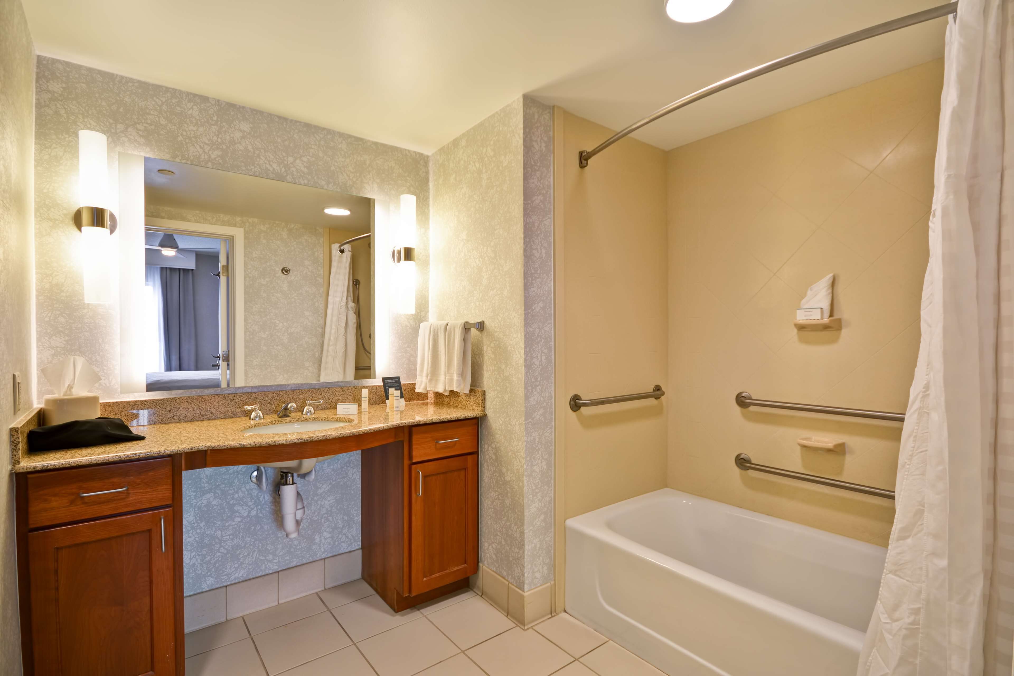 combined shower/bathtub, designer toiletries, hair dryer, towels