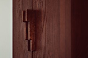 A wooden door with a simple, modern handle. - Hôtel des Académies et des Arts (Paris)