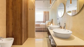 Suite, 1 King Bed with Sofa bed, City View | Bathroom | Combined shower/bathtub, free toiletries, hair dryer, bathrobes