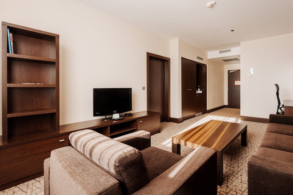 Suite, 1 King Bed with Sofa bed | Minibar, in-room safe, desk, blackout drapes