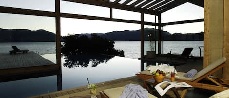 Indoor pool, outdoor pool, open 9 AM to 9 PM, pool umbrellas