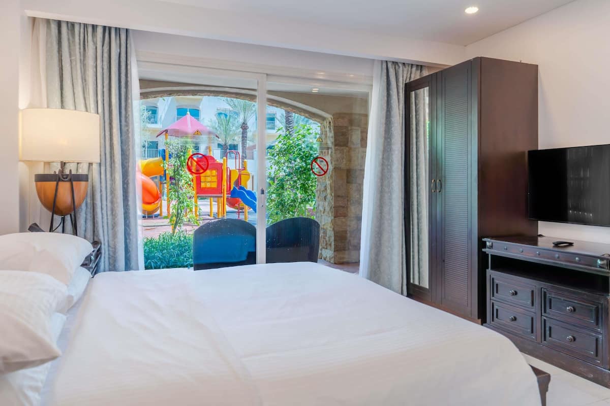 Room, 2 Bedrooms, Pool Access | Minibar, in-room safe, desk, blackout drapes