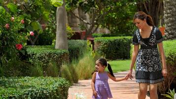 Stroll through the beautifully maintained garden, surrounded by lush greenery and vibrant flowers.