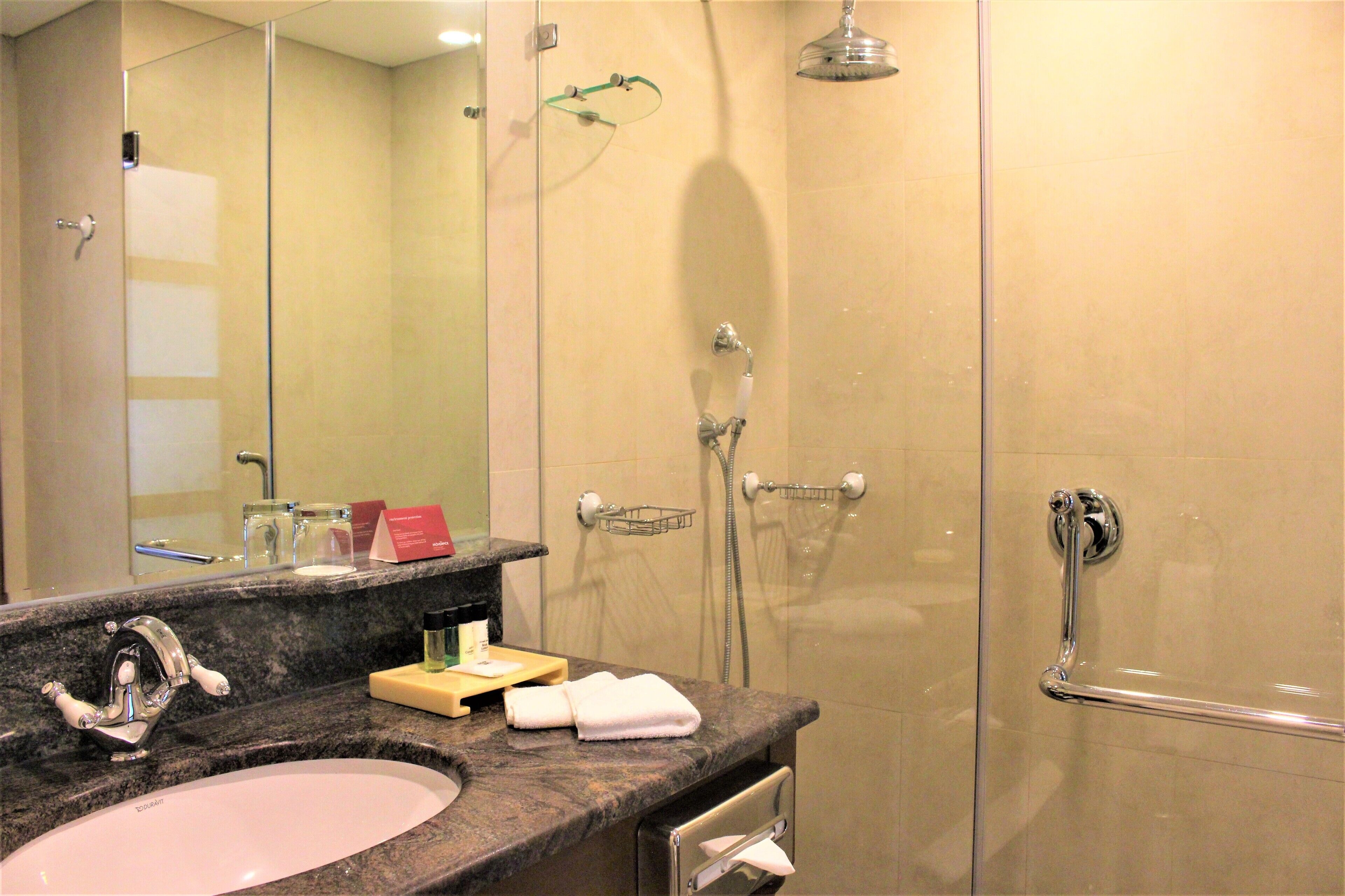 Separate tub and shower, designer toiletries, hair dryer, bathrobes
