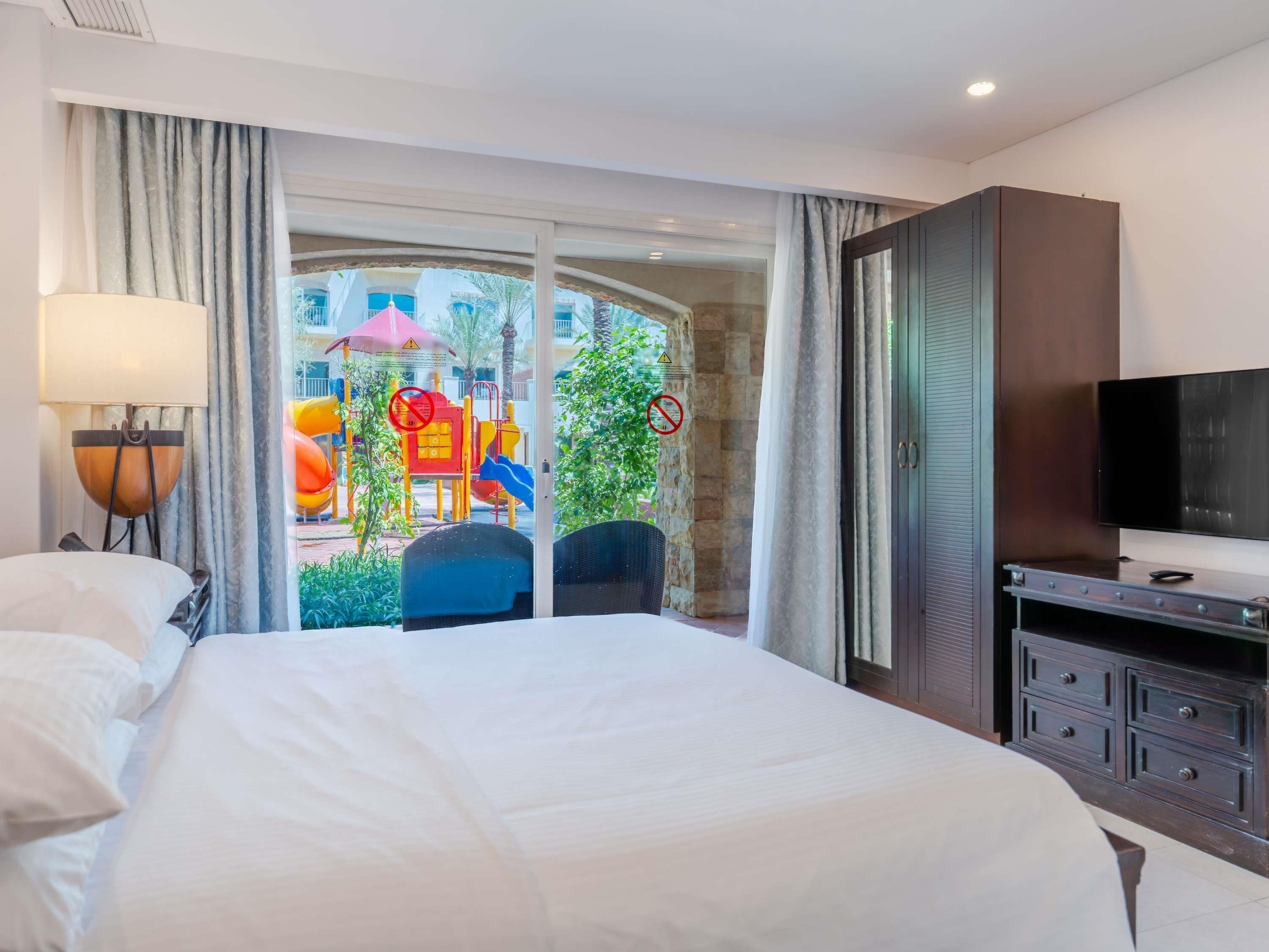 Room, 2 Bedrooms, Pool Access | Minibar, in-room safe, desk, blackout curtains