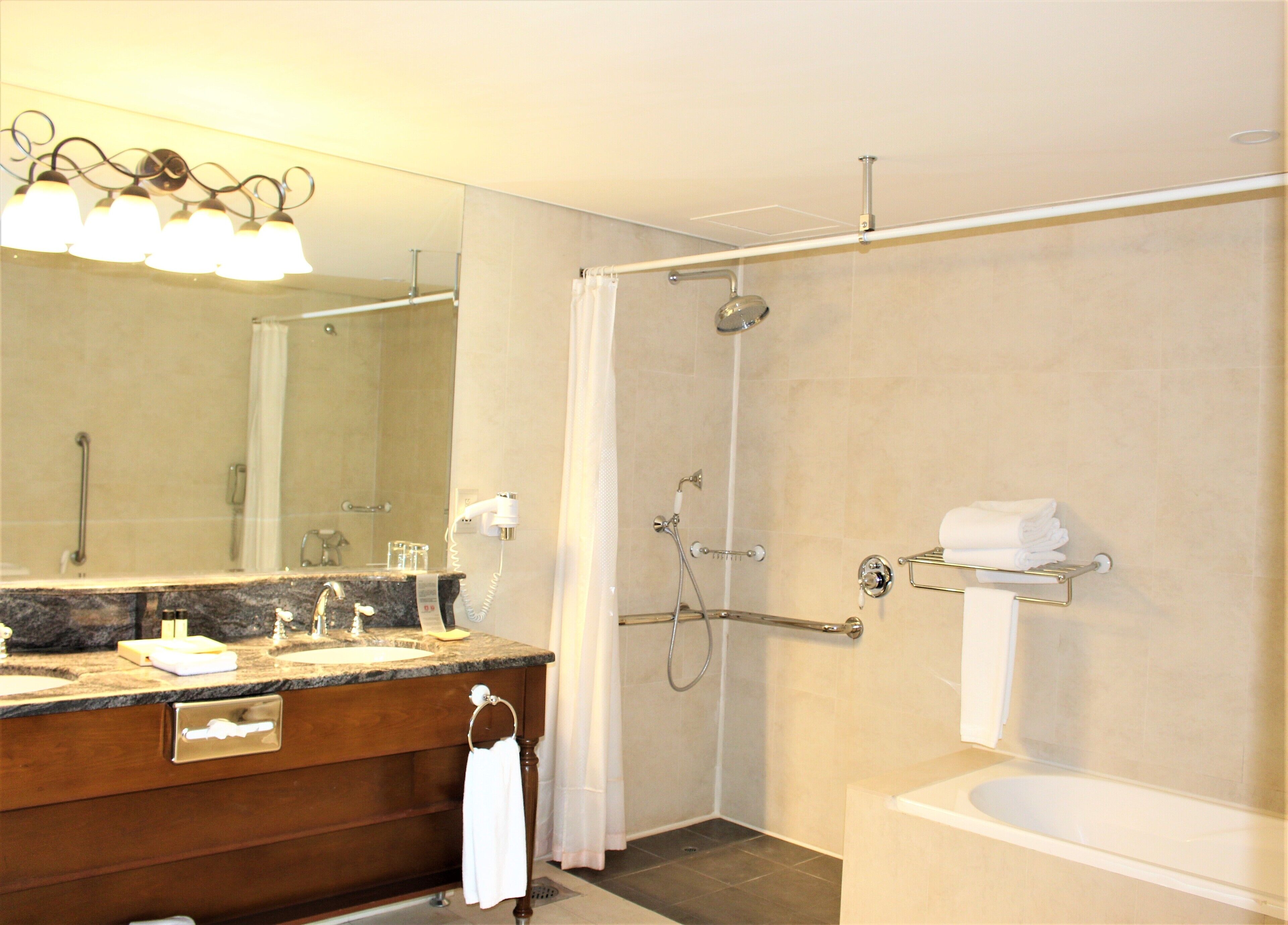 separate bathtub and shower, designer toiletries, hair dryer, bathrobes