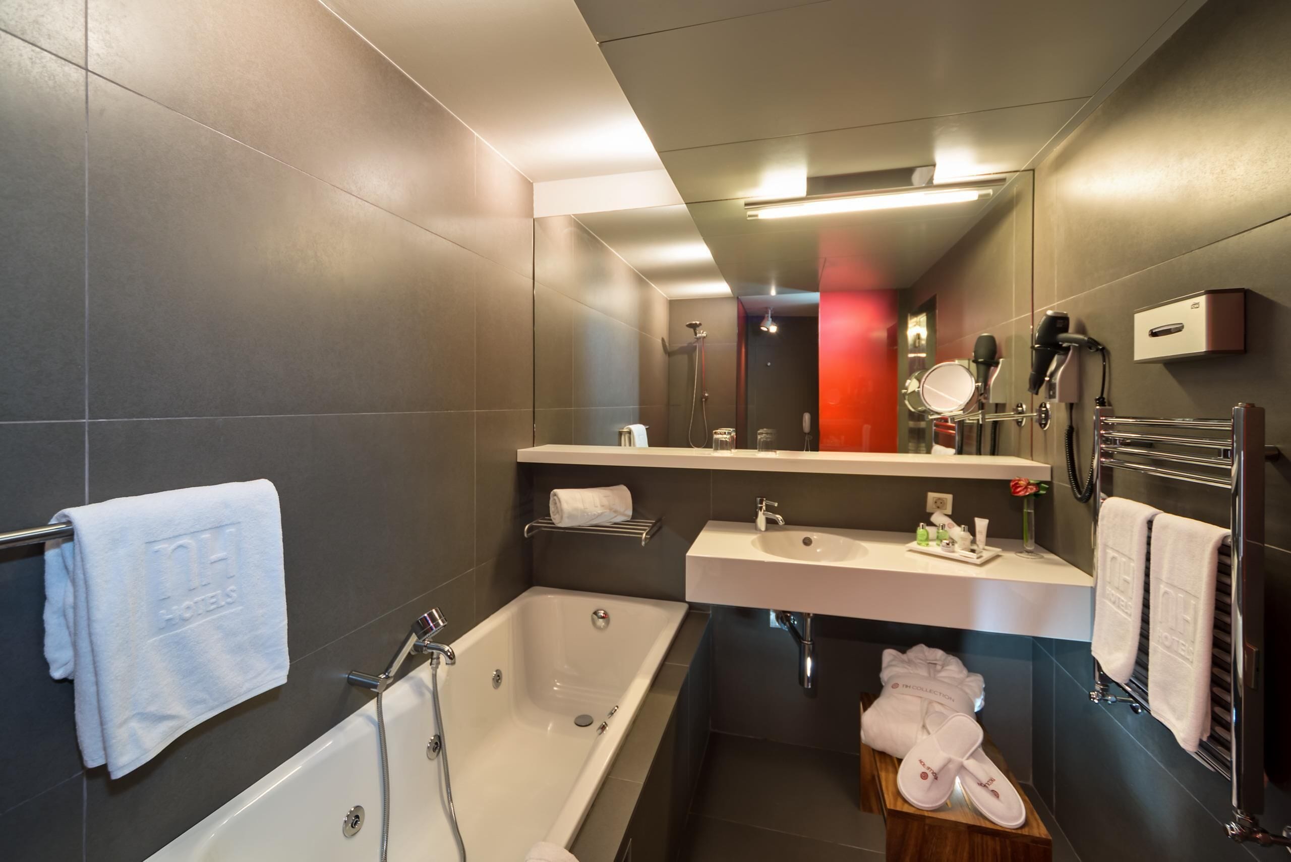 designer toiletries, hair dryer, towels