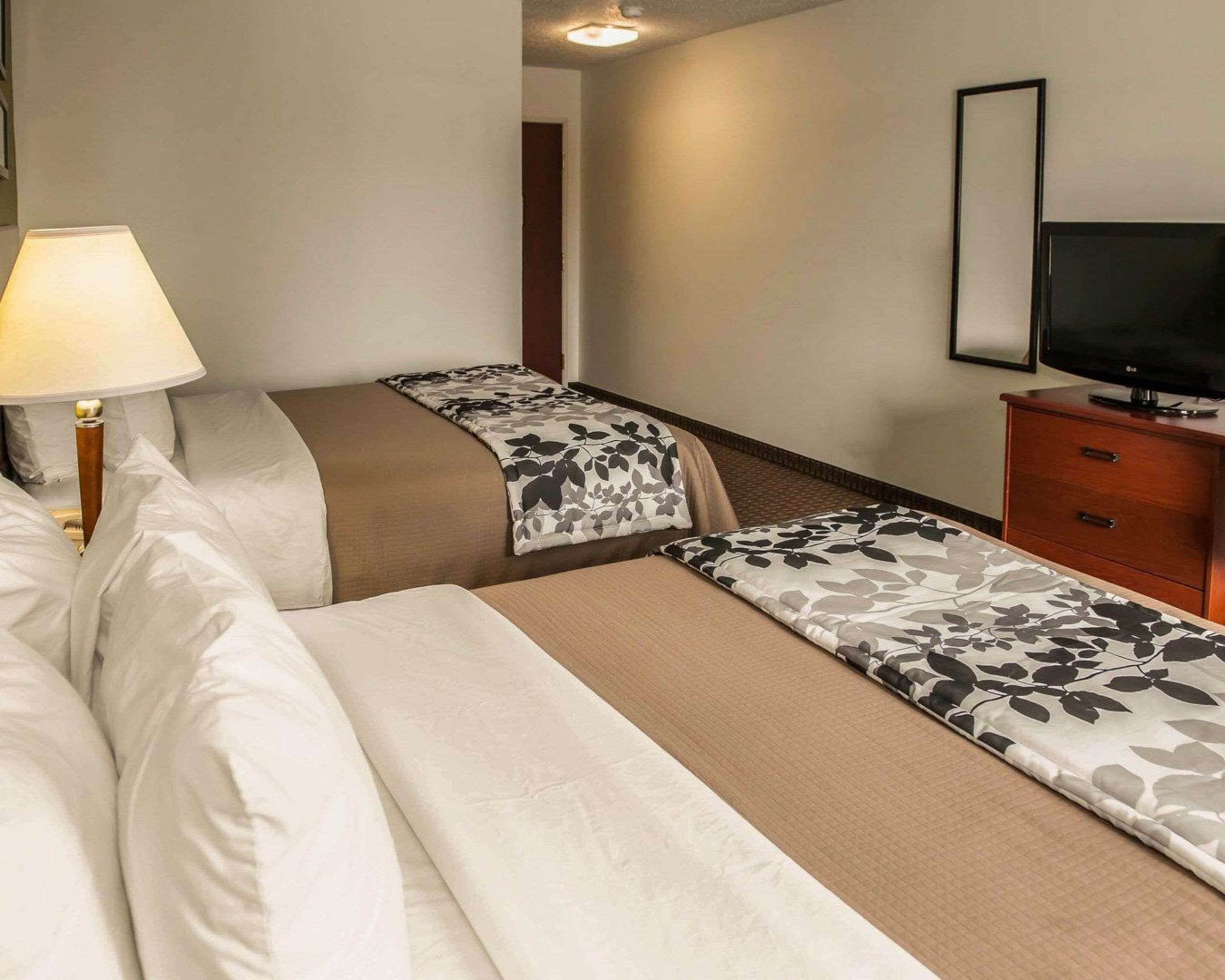 pillow-top beds, desk, blackout curtains, iron/ironing board