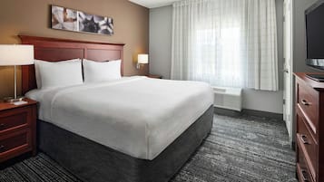 Premium bedding, desk, laptop workspace, blackout curtains
