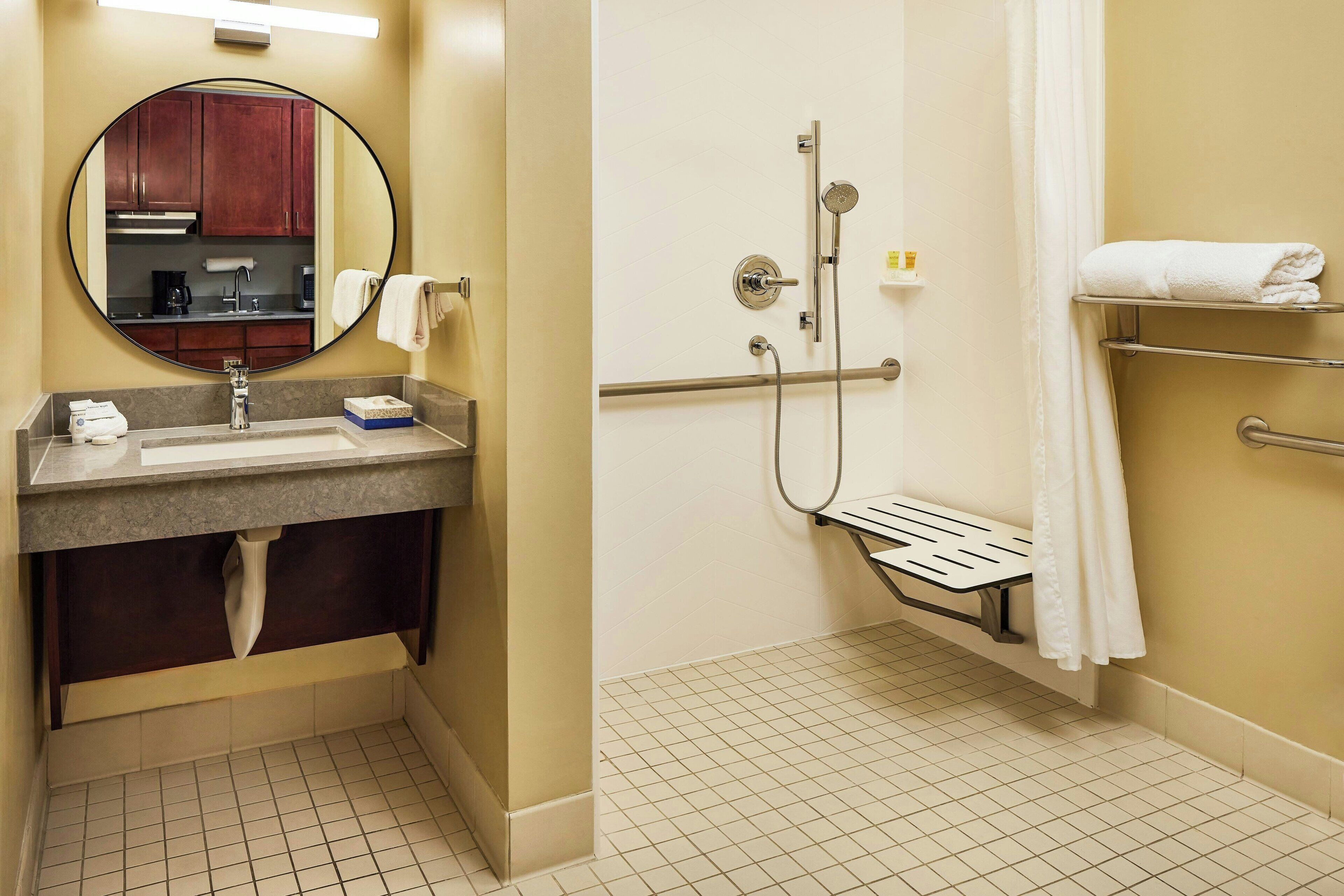 combined shower/bathtub, designer toiletries, hair dryer, towels