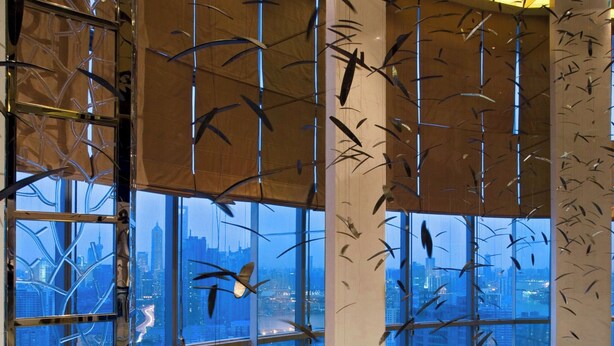 A high-rise hotel lobby with large windows, a seating area, and a view of the cityscape. - Sheraton Grand Shanghai Pudong Hotel & Residences (Shanghai)