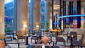 A spacious lobby with high ceilings, large windows, and modern furnishings. - Sheraton Grand Shanghai Pudong Hotel & Residences (Shanghai)