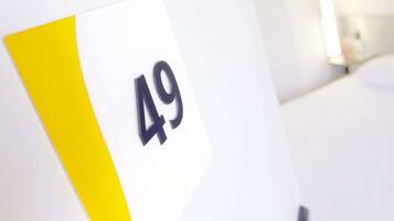 A room number sign with the number 49.