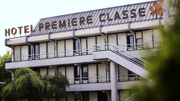 A hotel named "HOTEL PREMIERE CLASSE" with a modern architectural design, featuring a prominent balcony and a staircase leading to the entrance. - Hotel Première Classe Salon De Provence (Salon-de-Provence)