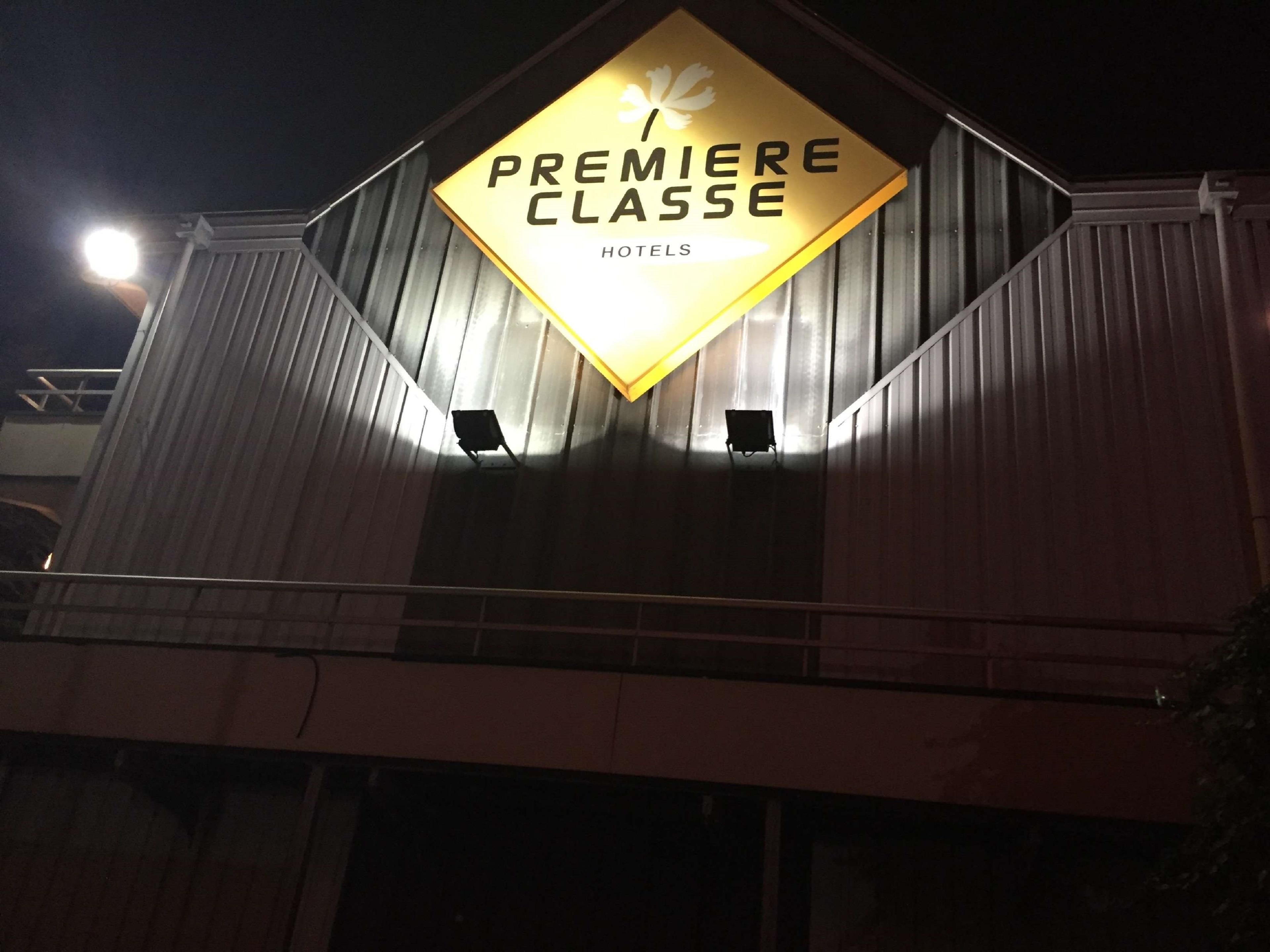 A hotel sign with the text "Premiere Classe Hotels".