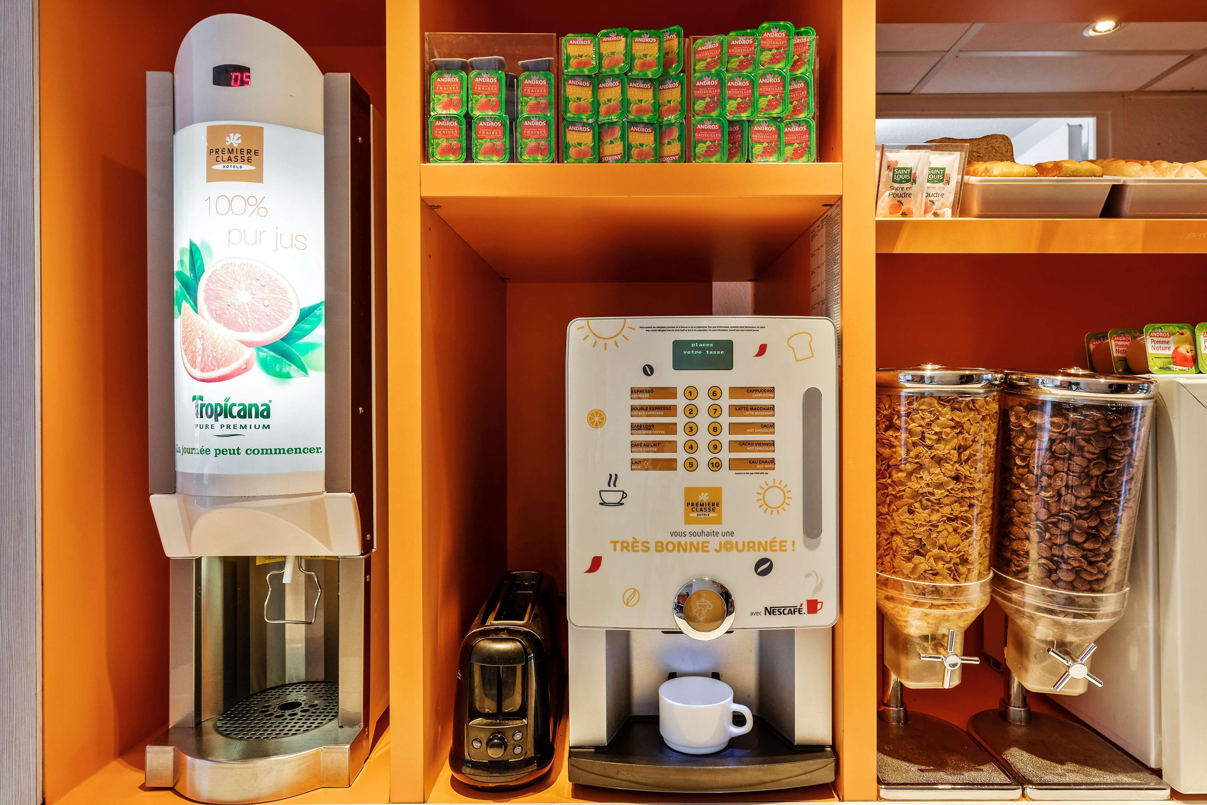 A coffee station with a coffee machine, a coffee pot, and two coffee dispensers.