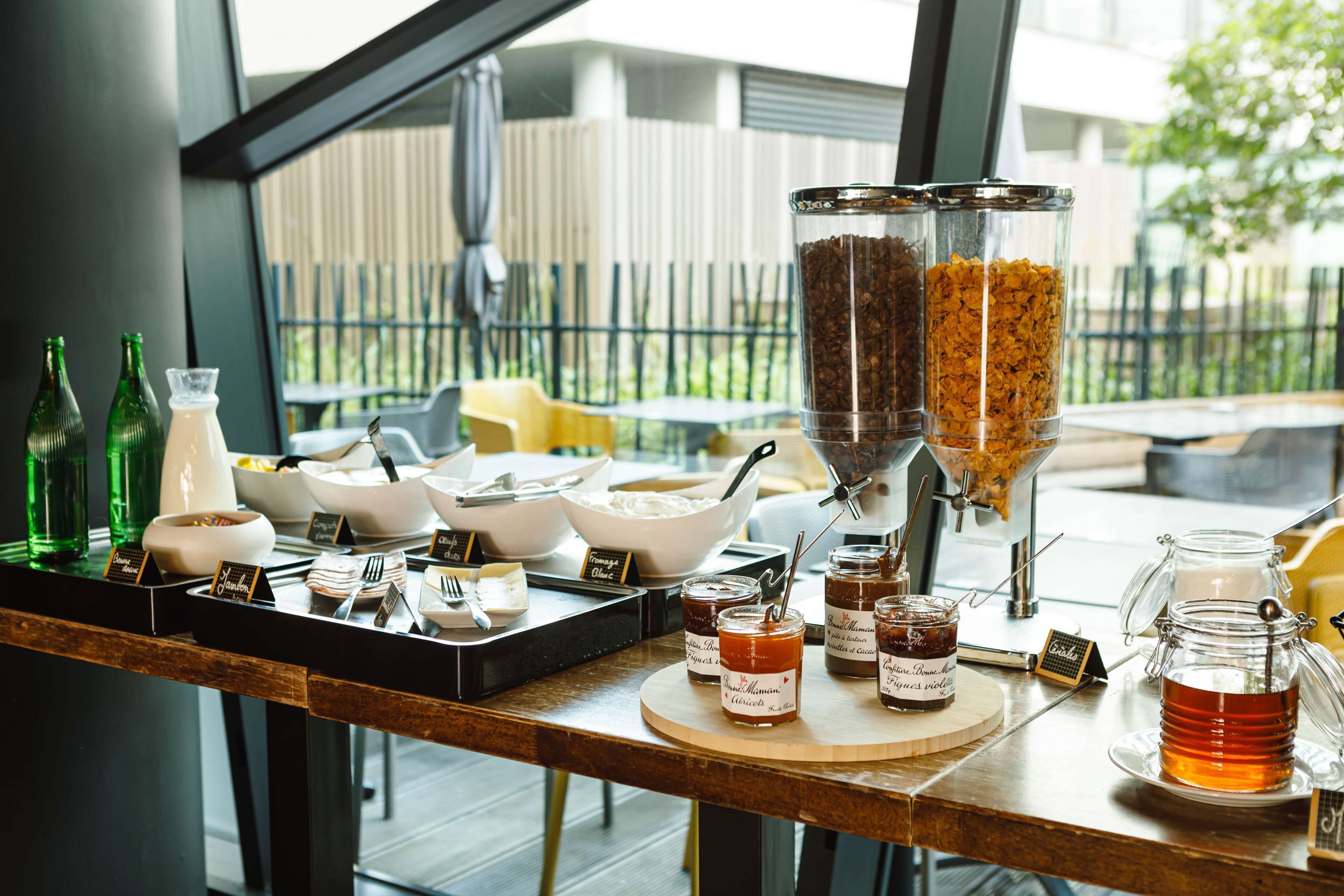 A breakfast buffet with various food items and condiments.