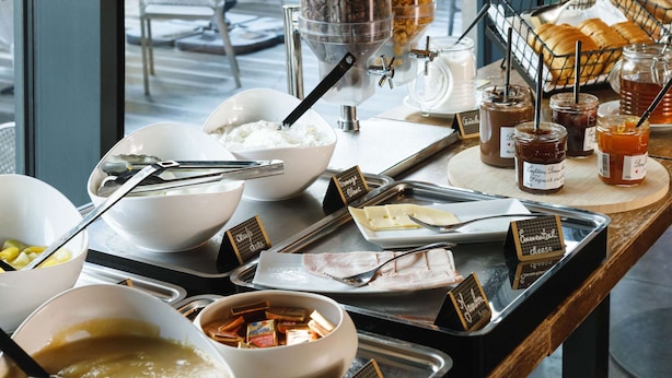A breakfast buffet with various food items and condiments. - Premiere Classe Lyon Centre - Gare Part Dieu (Lyon)