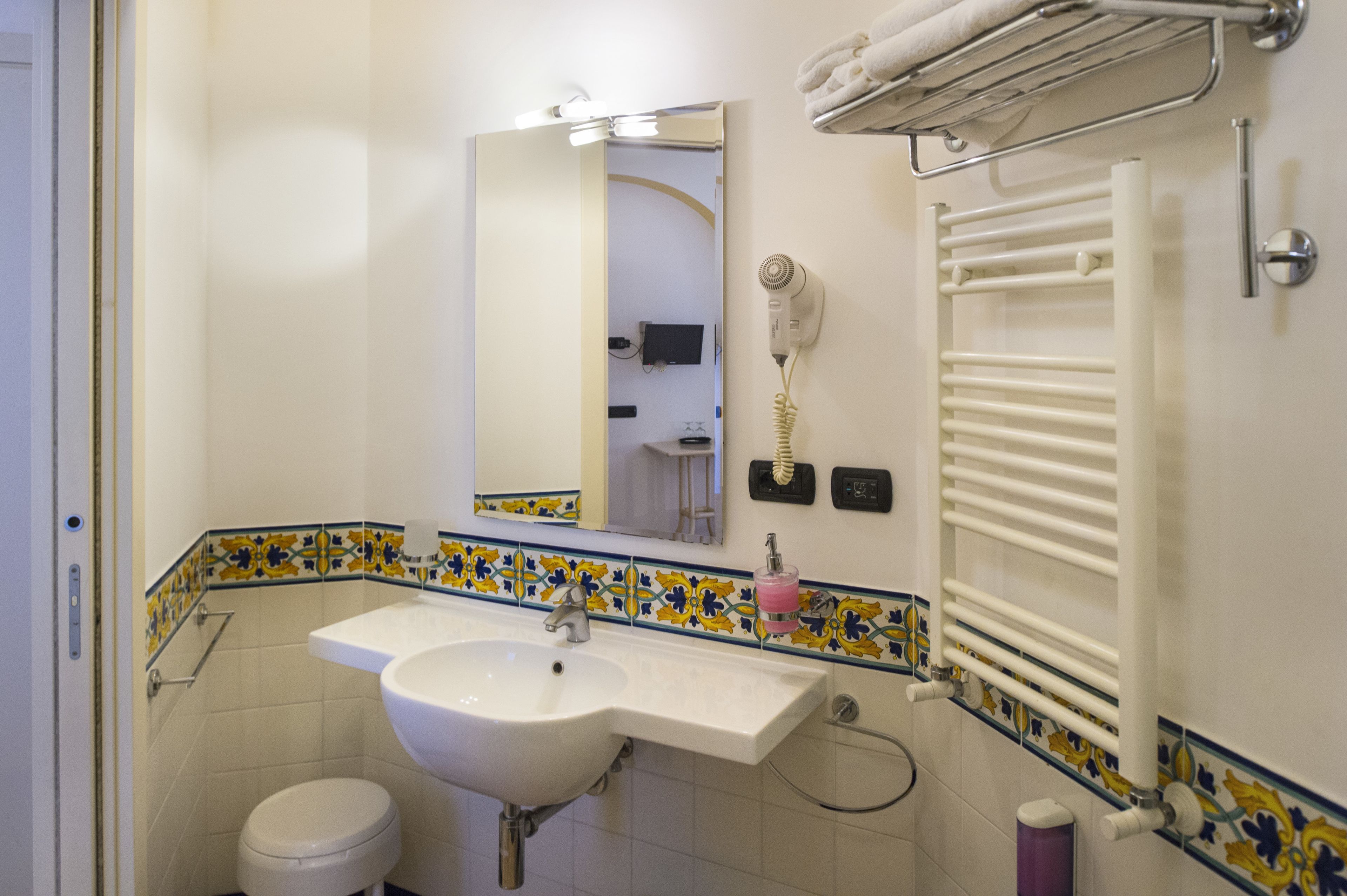 standard double room (no sea view) | bathroom | eco-friendly toiletries, hair dryer, bidet, towels