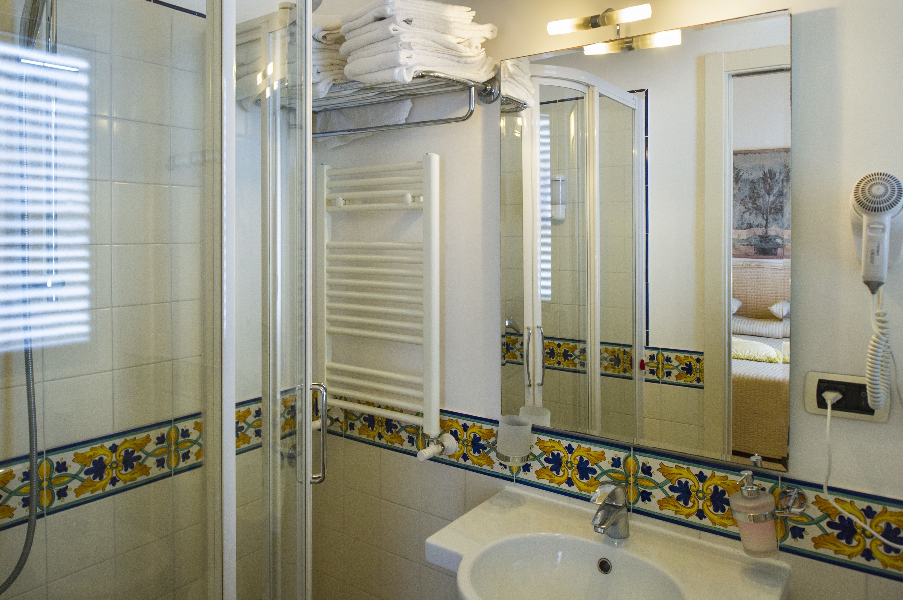 standard triple room (no sea view) | bathroom | eco-friendly toiletries, hair dryer, bidet, towels