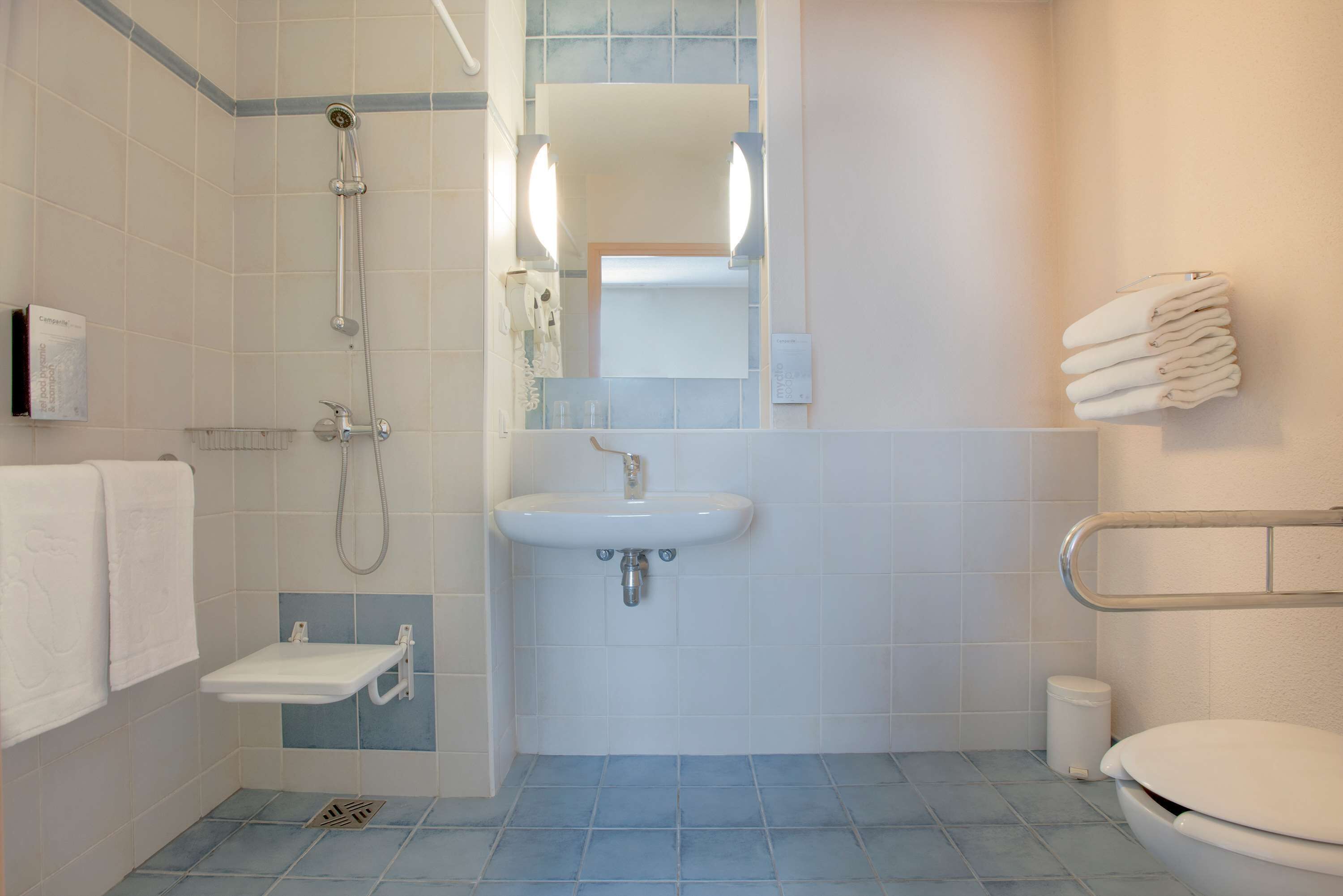 eco-friendly toiletries, hair dryer, towels