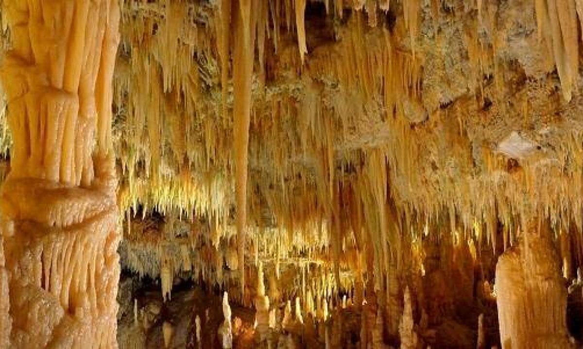 A cave interior with stalactites and stalagmites.