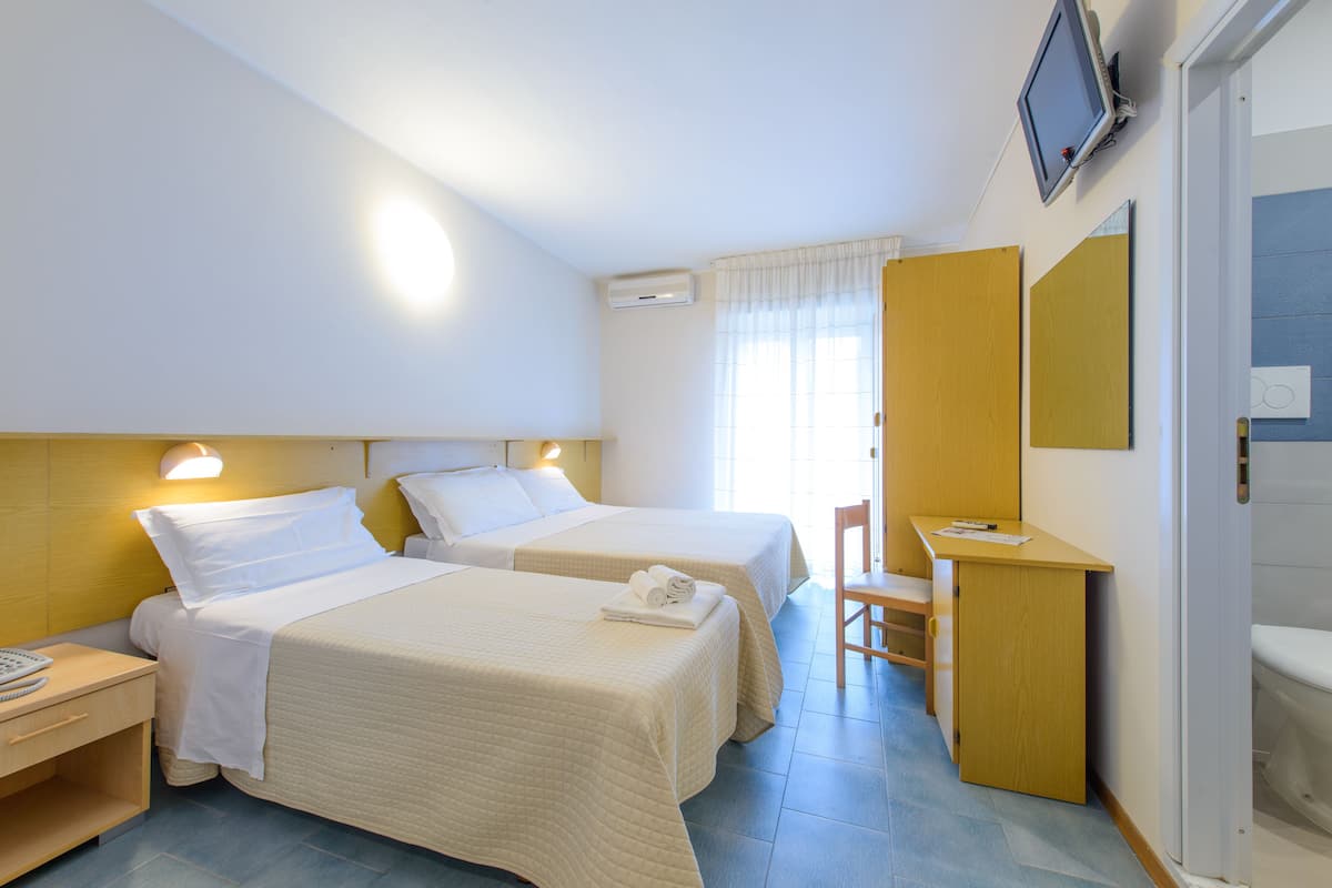 Standard Triple Room, 1 Bedroom | In-room safe, desk, iron/ironing board, cribs/infant beds