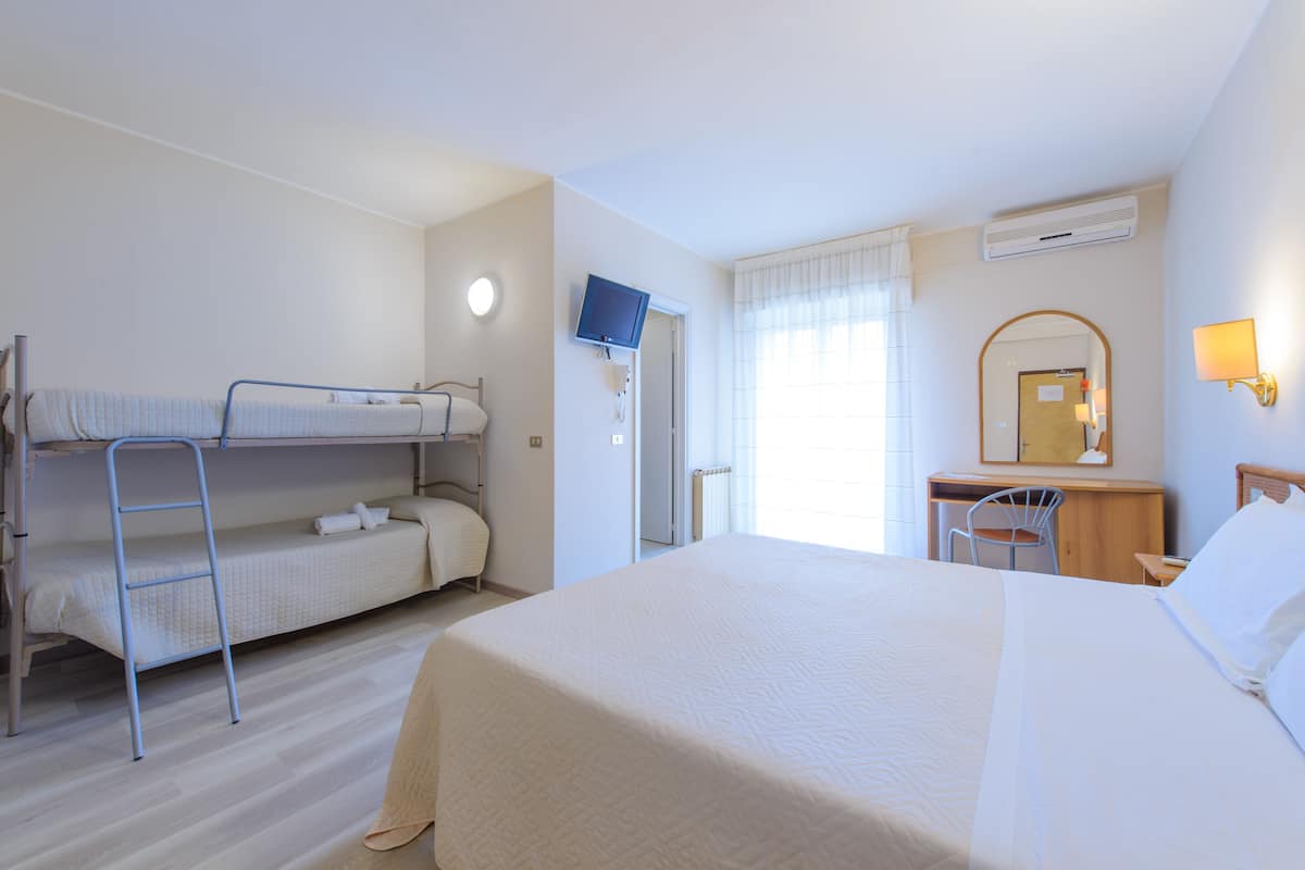 Standard Quadruple Room, 1 Bedroom | In-room safe, desk, iron/ironing board, cribs/infant beds