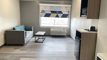 Premium bedding, desk, laptop workspace, blackout curtains