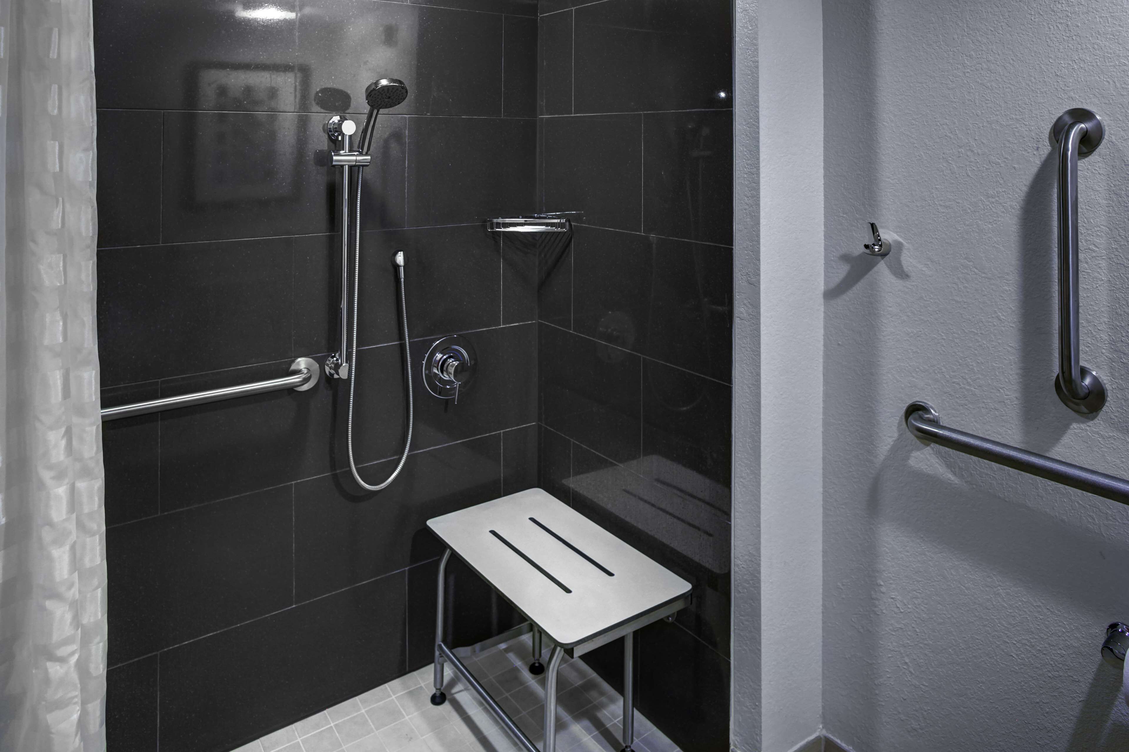 combined shower/bathtub, designer toiletries, hair dryer, towels