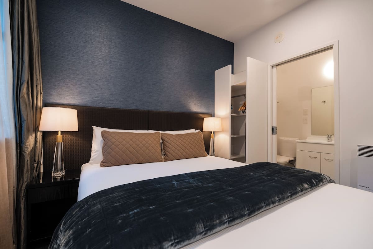 2 bedrooms, premium bedding, laptop workspace, blackout drapes