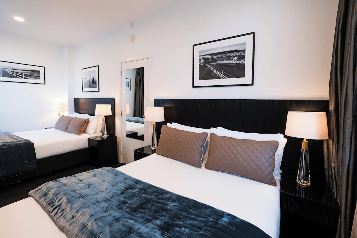 2 bedrooms, premium bedding, laptop workspace, blackout drapes