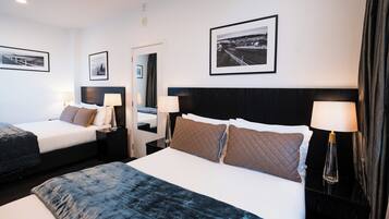 1 Bedroom Twin Apartment | Premium bedding, laptop workspace, blackout drapes, iron/ironing board