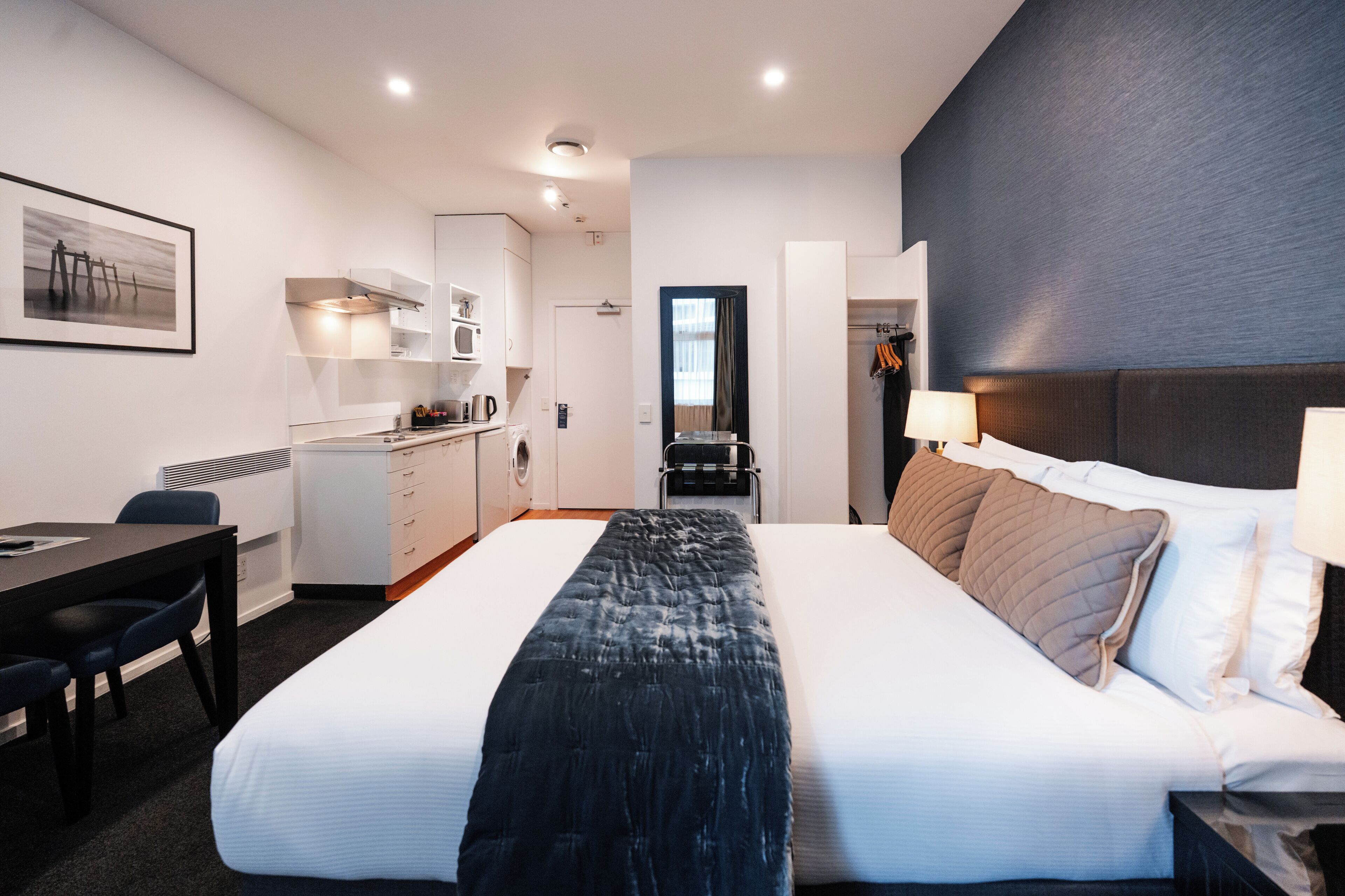 Premium bedding, laptop workspace, blackout curtains, iron/ironing board