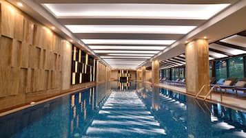 Indoor pool, open 6:00 AM to 10:00 PM, pool loungers