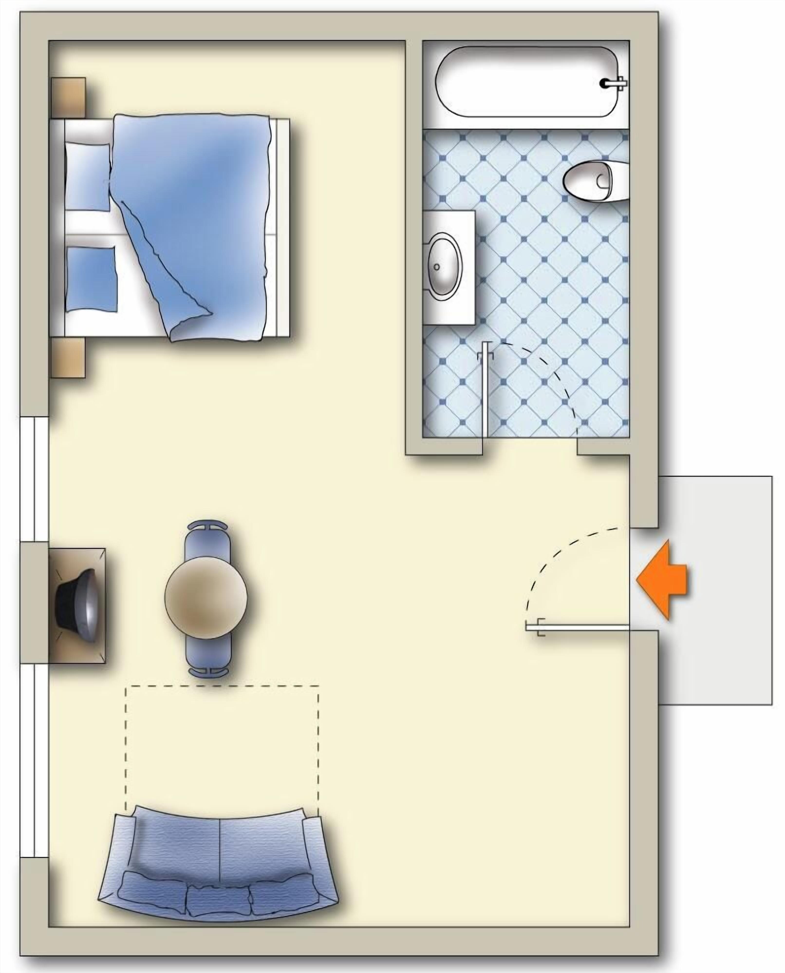 A bedroom with a bed, a bedside table, and a lamp.