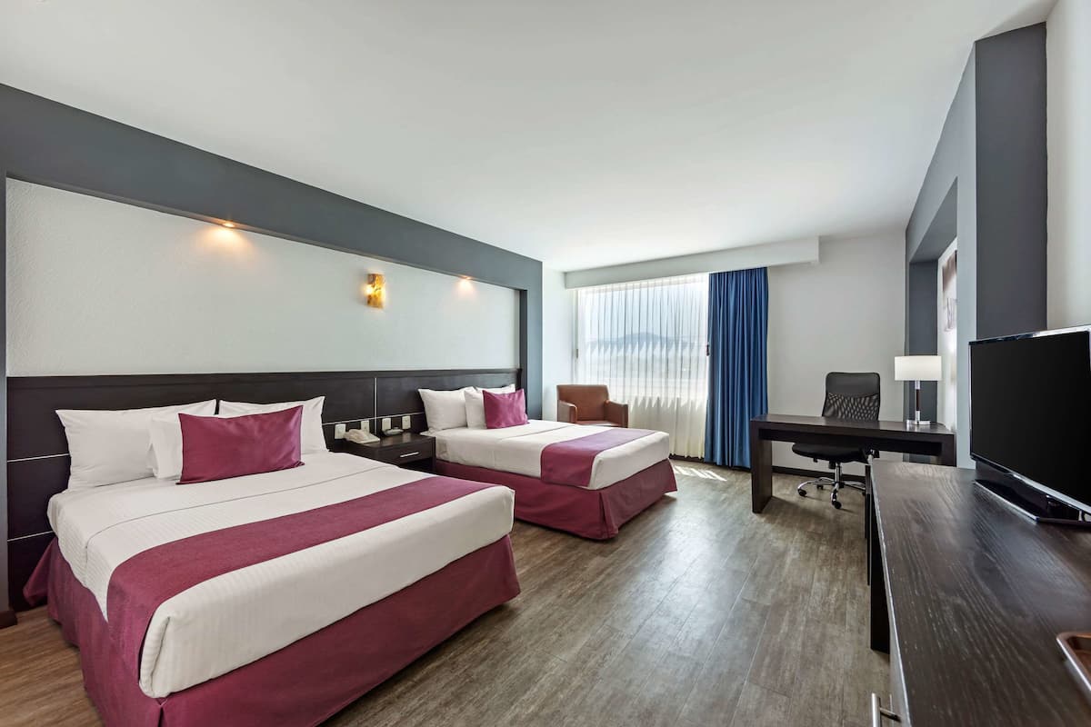 room, 2 double beds | in-room safe, desk, laptop workspace, iron/ironing board