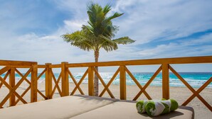 A beach view from a wooden deck with a bed and a towel. - Hyatt Zilara Cancun   - Adults Only - All Inclusive (Cancun)