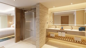A modern hotel bathroom with a glass shower enclosure, a large mirror, and a vanity with a towel rack. - Hyatt Zilara Cancun   - Adults Only - All Inclusive (Cancun)