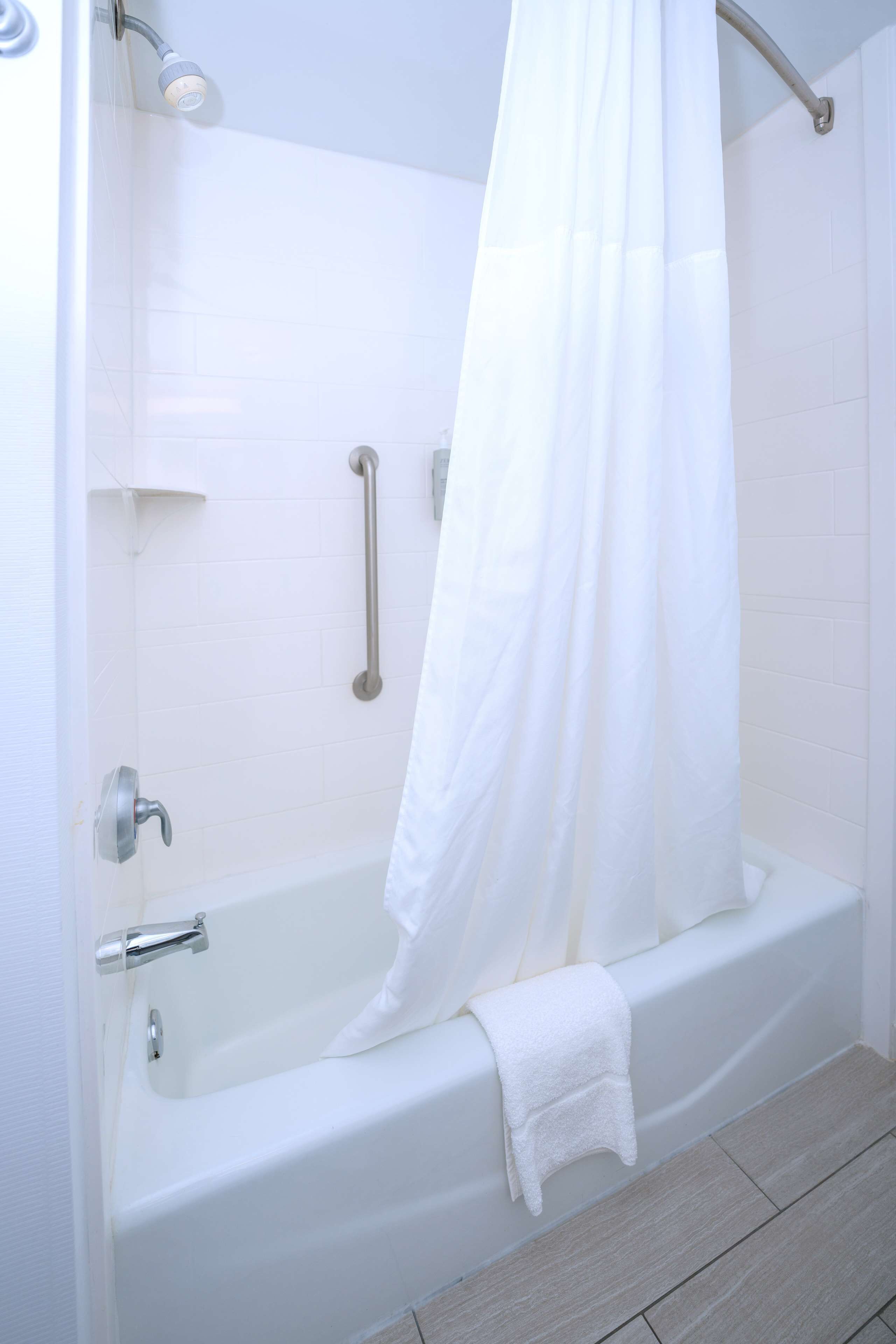 two queen beds nonsmoking | bathroom | hydromassage showerhead, hair dryer, towels, soap