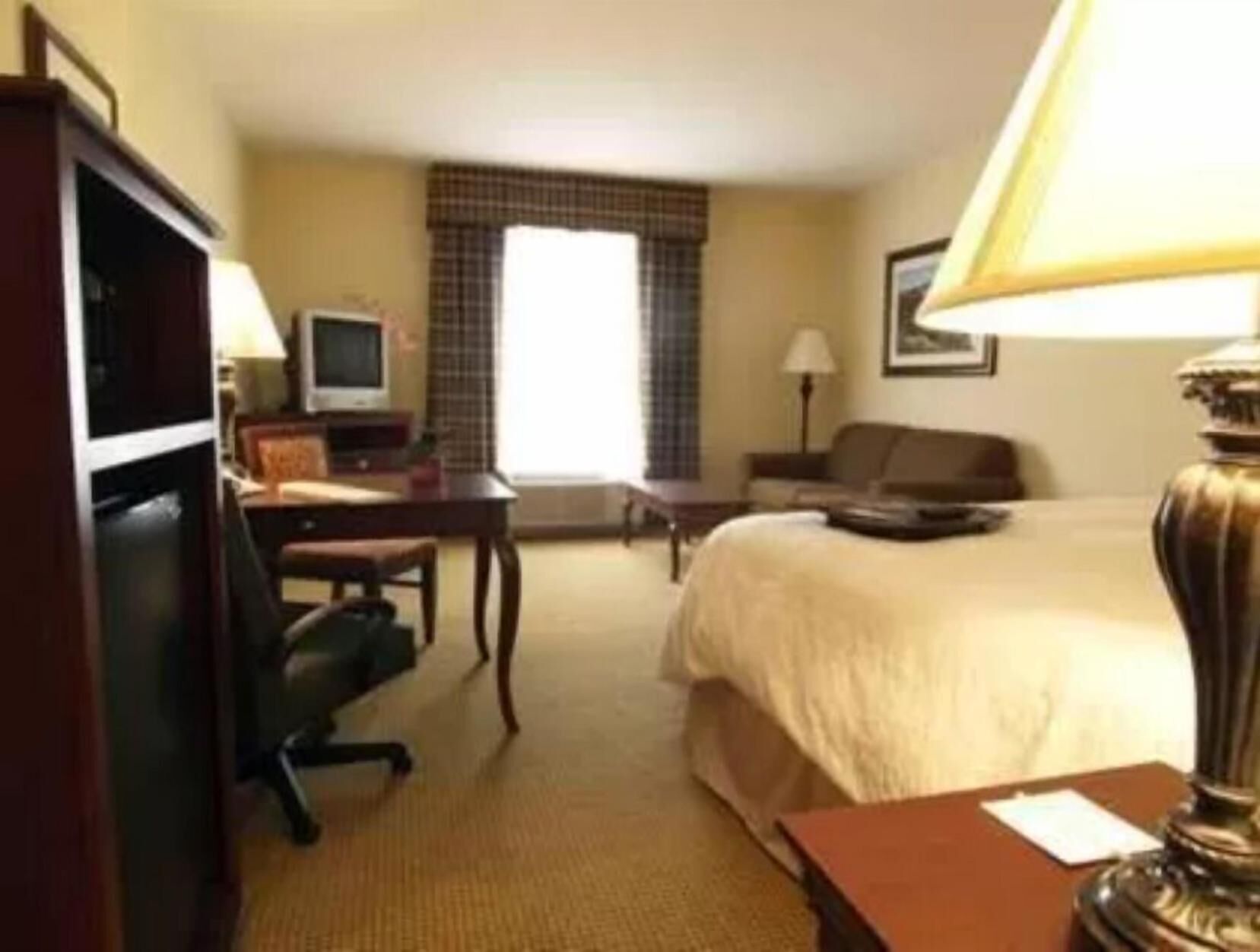 Desk, laptop workspace, blackout drapes, iron/ironing board