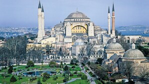 A large historic building with multiple domes and minarets, surrounded by a well-maintained park and a body of water. - Boutique Dedem Hotel (Istanbul)