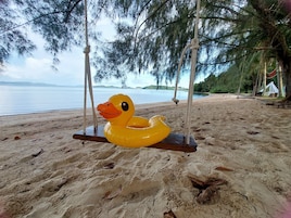 On the beach, white sand, free beach cabanas, sun loungers