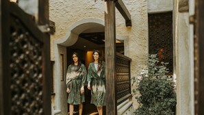 A narrow corridor with a stone wall and a wooden door frame. - Sun Spa Resort & Villas (Dong Hoi)