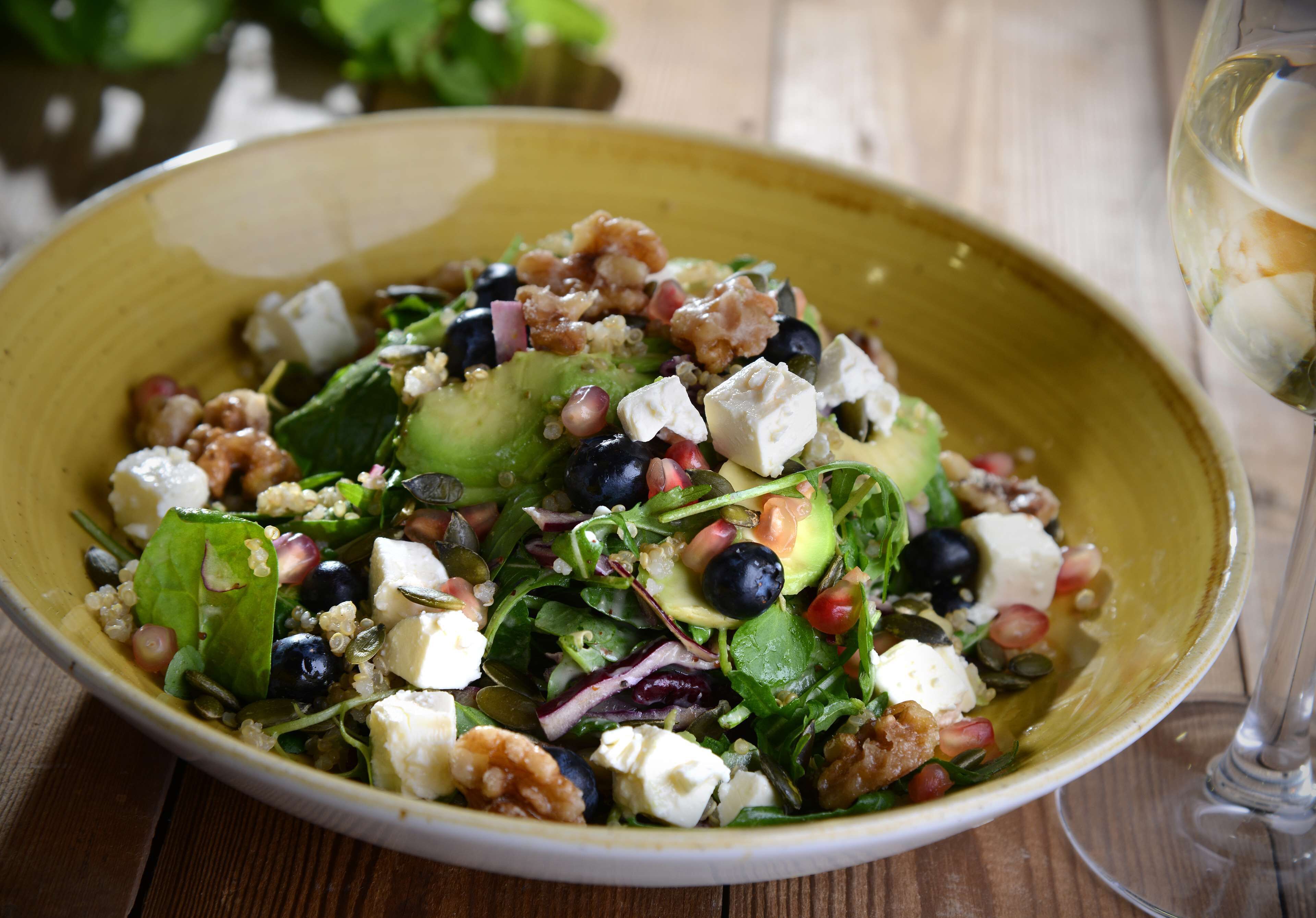 A bowl of salad with various ingredients.