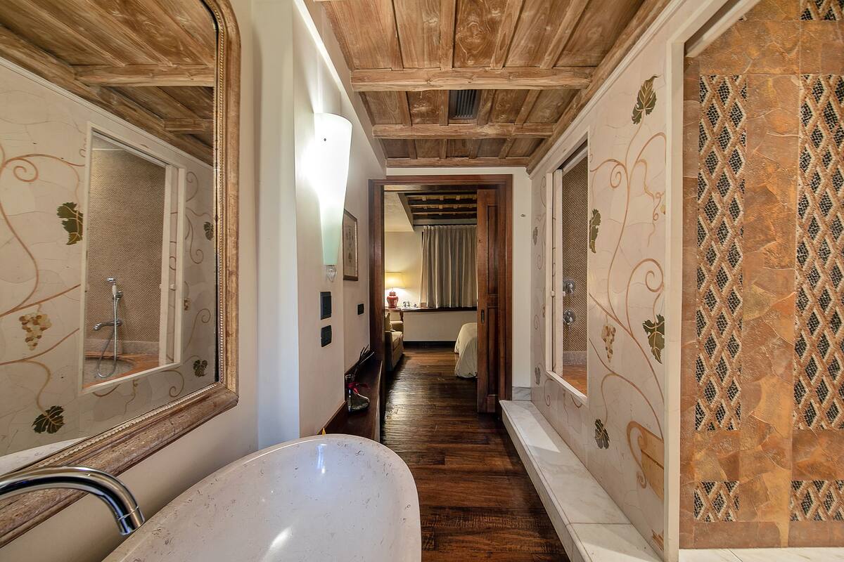 designer toiletries, hair dryer, bathrobes, bidet