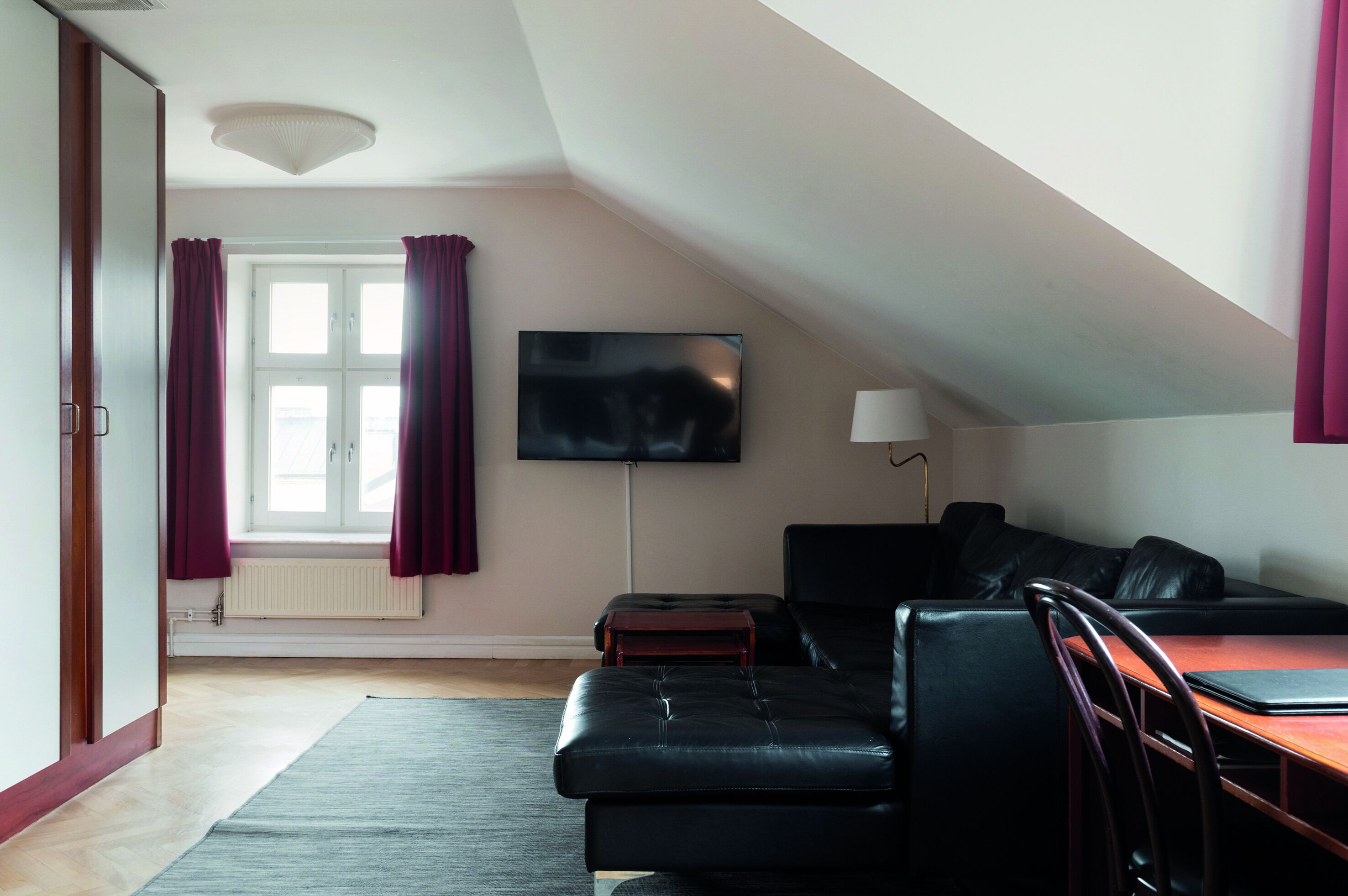 deluxe twin room | living area | 48-inch tv with cable channels