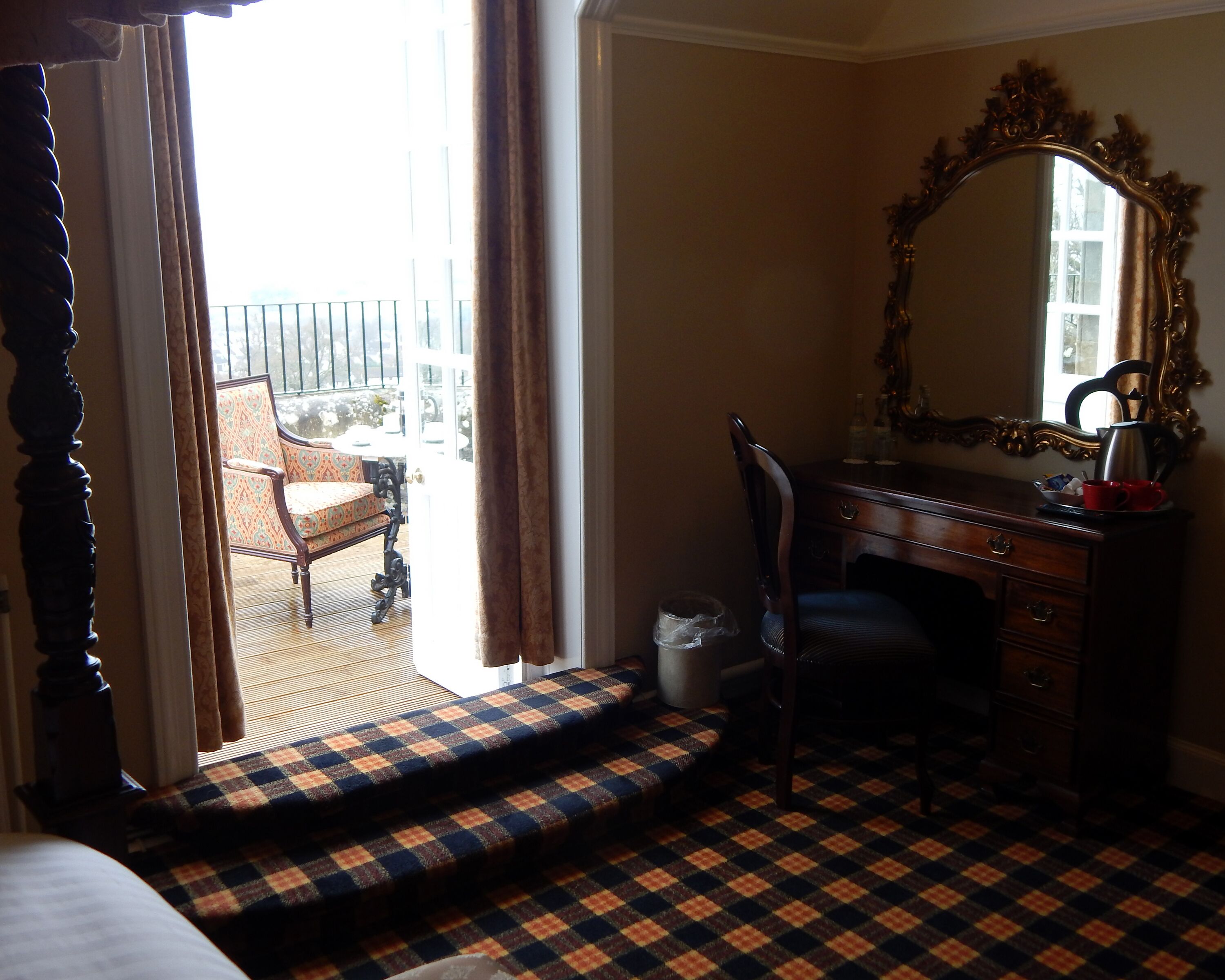 four poster room with balcony | individually decorated, individually furnished, desk, iron/ironing board
