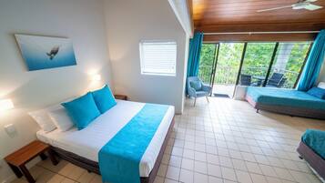 Family Room (Reef Family Room) | Desk, bed sheets, alarm clocks