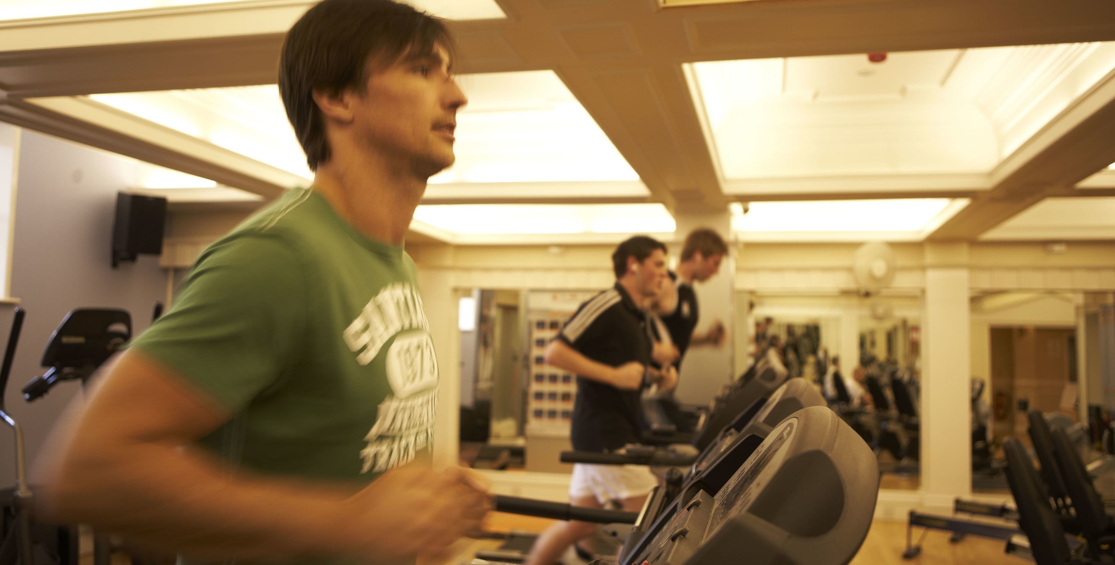 A gym with treadmills and exercise equipment.